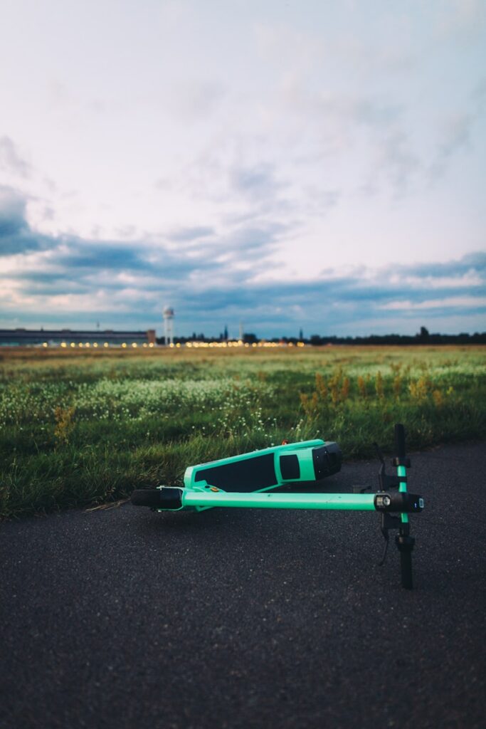 green and black skateboard on road during daytime